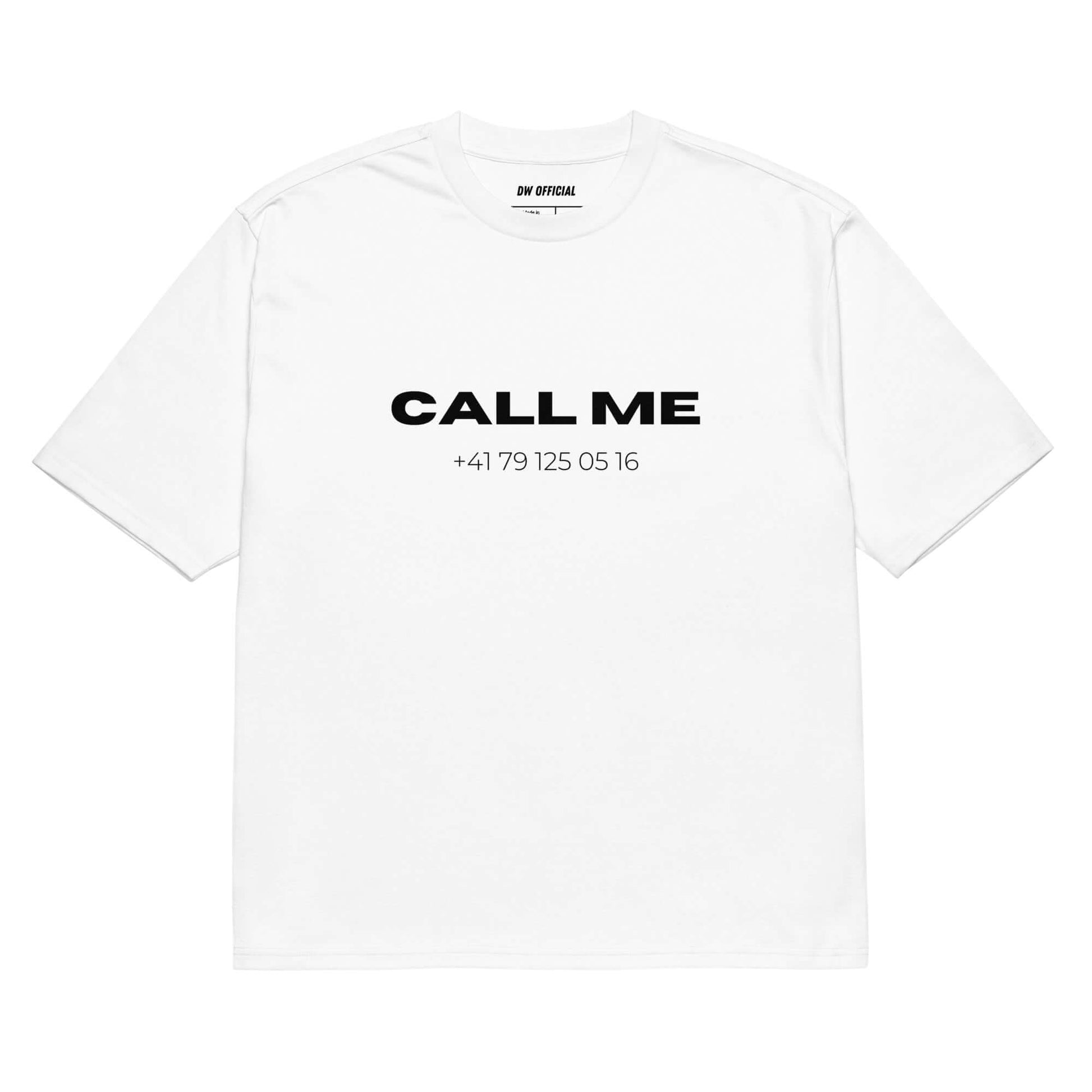 White oversized t-shirt with the slogan "Call Me" and a random swiss phone number printed on the front, unisex design.